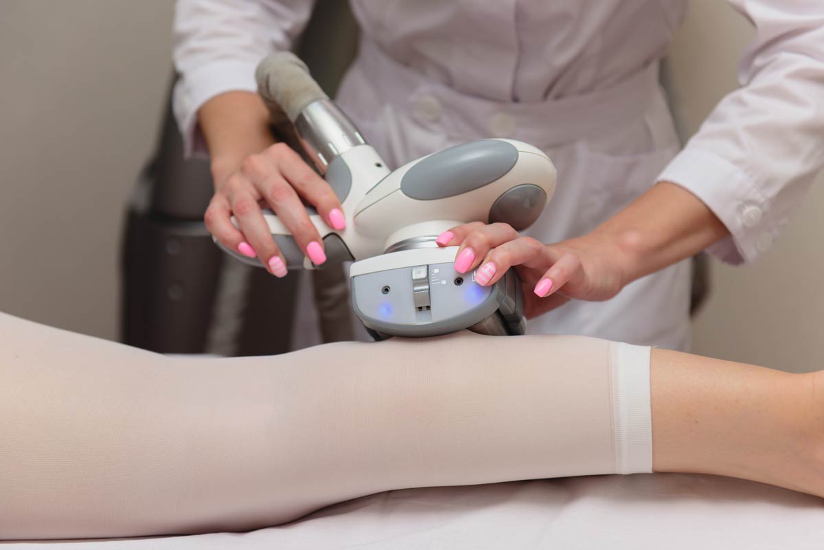 A woman getting endermologie treatment for her legs